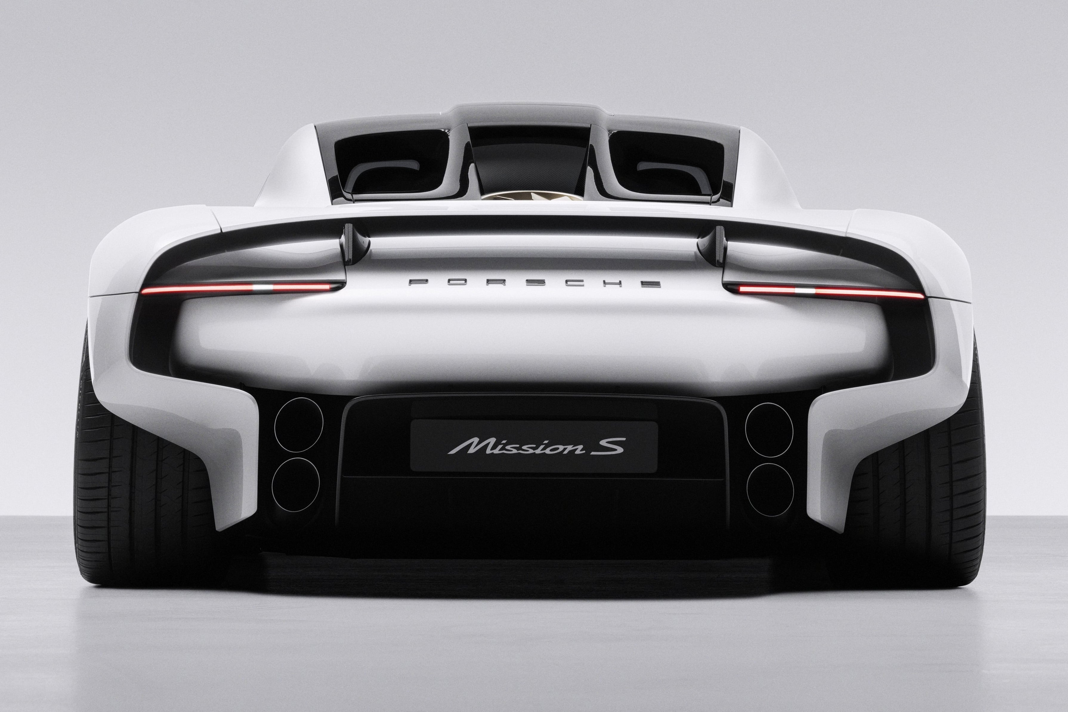 The rear features a prominent diffuser and quad exhausts, previewing its petrol flagship role