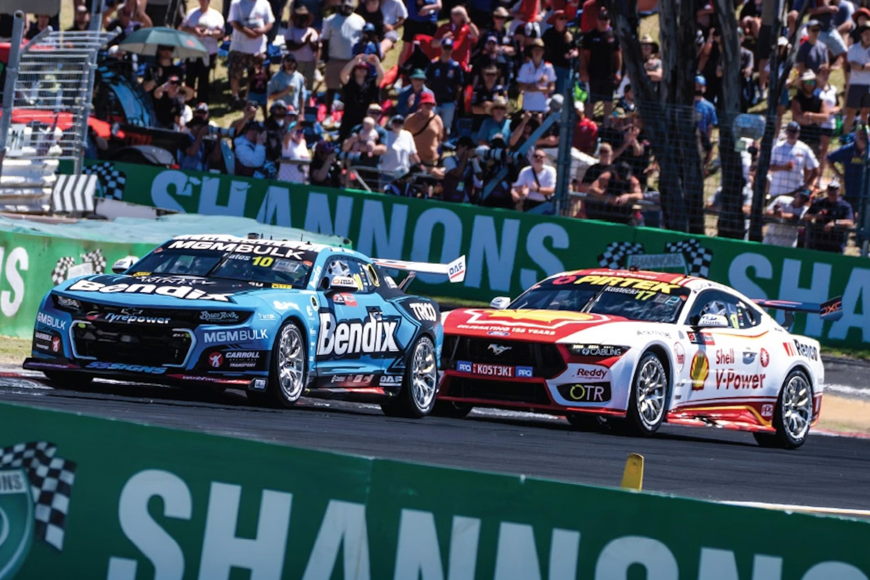 The Bendix-backed Supercar leads a rival through a corner, underlining the brand's motorsport presence.