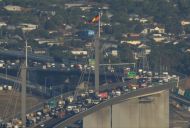 Climate protesters block Melbourne's West Gate Bridge, increasing emissions