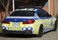 Cop charged with dangerous driving while racing to colleague's aid cleared in court