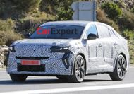 Renault's new, larger coupe SUV spied