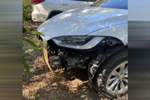 Rented Tesla Model X gets stuck on beach, front then ripped off car