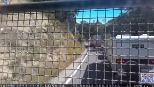 Truck's brakes fail down steep hill, oblivious caravan driver fails to get out of the way