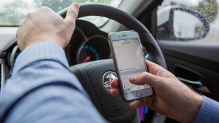 Is it illegal to use a mobile phone while driving?