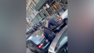 Shocking chase sees Cadillac topple police officer, trash street