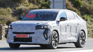 Renault's new, larger coupe SUV spied
