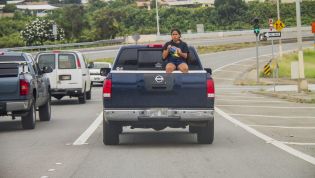 Is it illegal to ride in the back of a ute? Boot of a car?