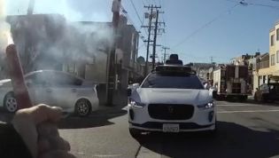 Watch police scream at a driverless car to make it stop