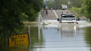 Is it illegal to drive in floodwaters or flooded roads?