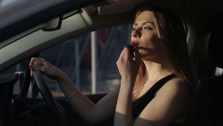 Is it illegal to do your makeup when driving?
