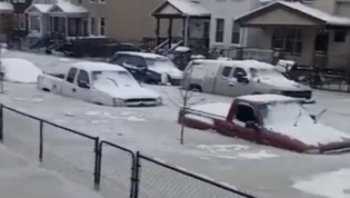 Dozens of cars stuck in ice after floodwater freezes