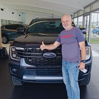A CarExpert customer with their new car