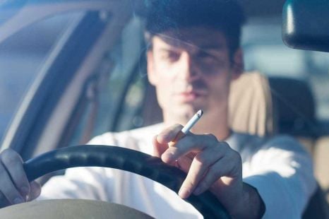 Is it illegal to drive while smoking?