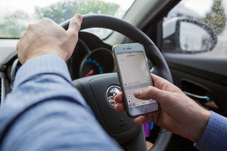 Is it illegal to use a mobile phone while driving?