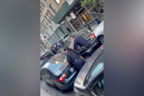 Shocking chase sees Cadillac topple police officer, trash street