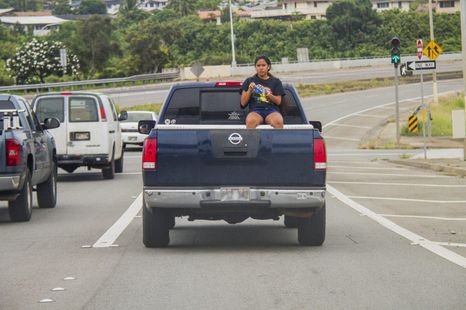 Is it illegal to ride in the back of a ute? Boot of a car?