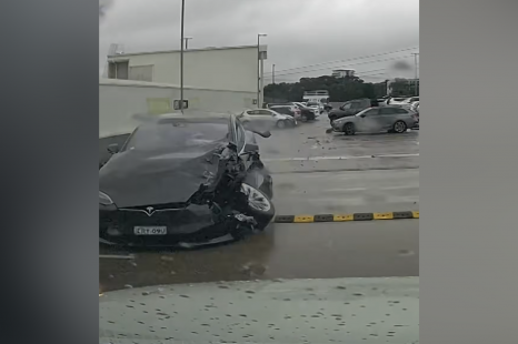 Out-of-control Tesla crashes into cars, plunges off carpark roof