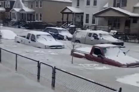 Dozens of cars stuck in ice after floodwater freezes