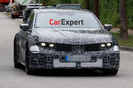Electric BMW M3 reveals its pumped-up wheel-arches