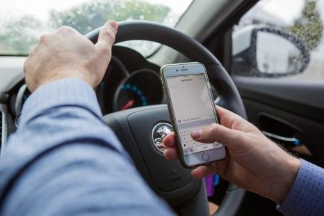 Is it illegal to use a mobile phone while driving?