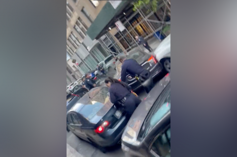 Shocking chase sees Cadillac topple police officer, trash street