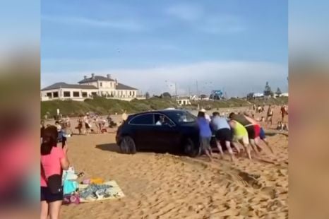 Porsche pandemonium on busy beach as luxury SUV gets bogged