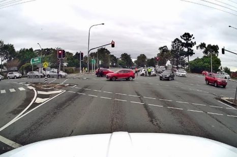 Watch this tradie stop speeding red-light runner from leaving crash scene