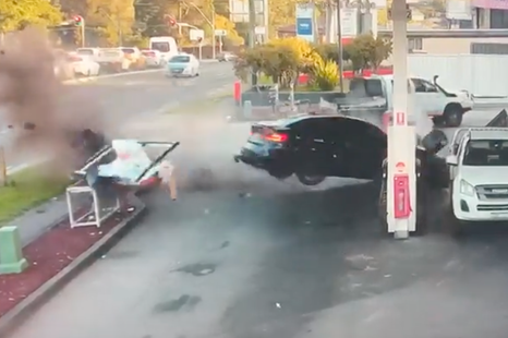 Pedestrian lucky to be alive after BMW M3 goes sideways into a petrol bowser