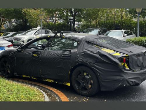 Lotus' new Porsche Taycan rival spied