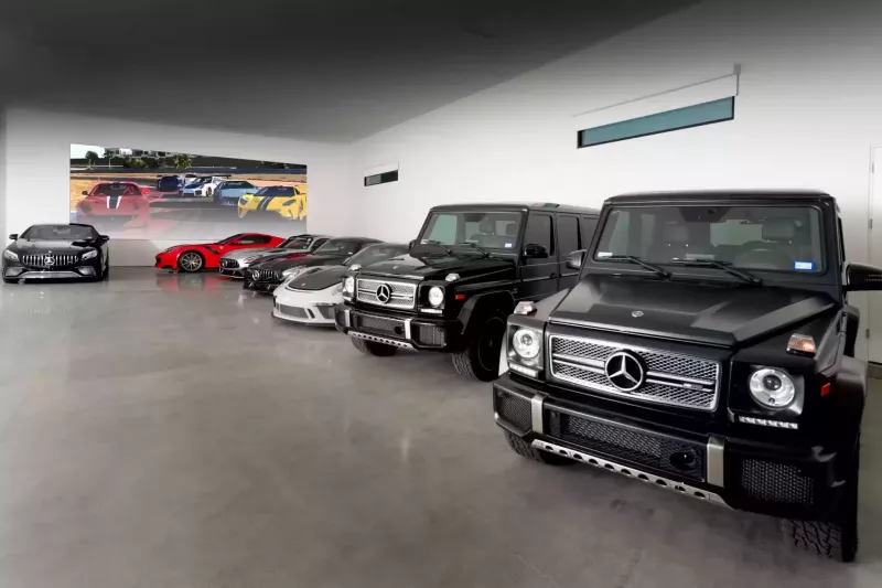 The ultimate bachelor pad: 1 bed, 30-car garage, and 3 racetracks in the backyard