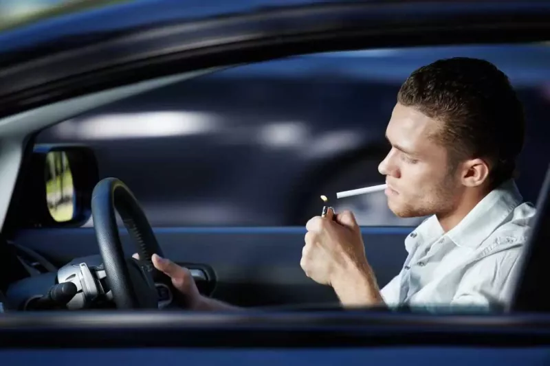 Is it illegal to drive while smoking?