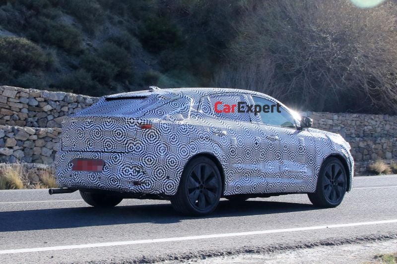 Renault's new, larger coupe SUV spied