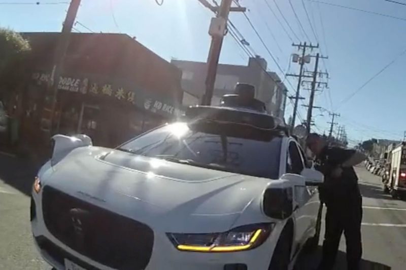 Watch police scream at a driverless car to make it stop
