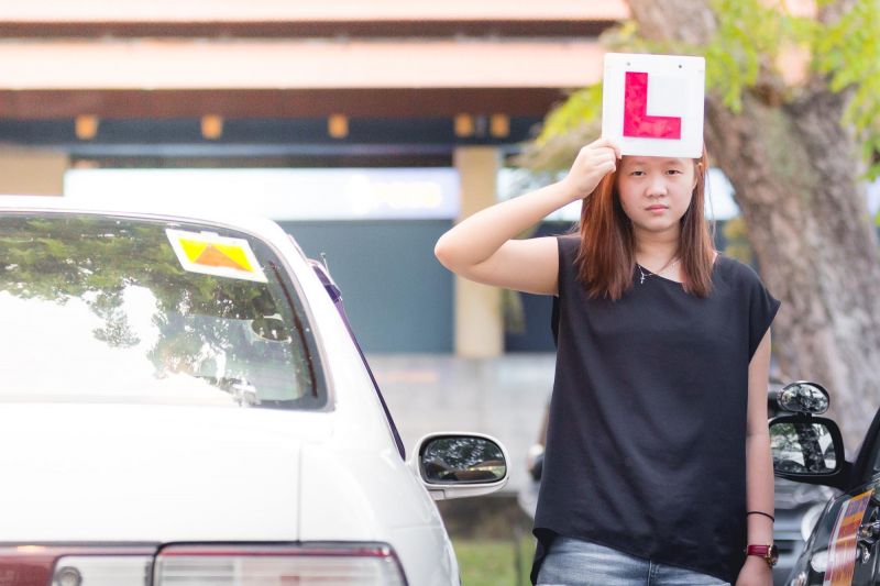 Can I be fined for driving with L or P plates if I hold a full licence?