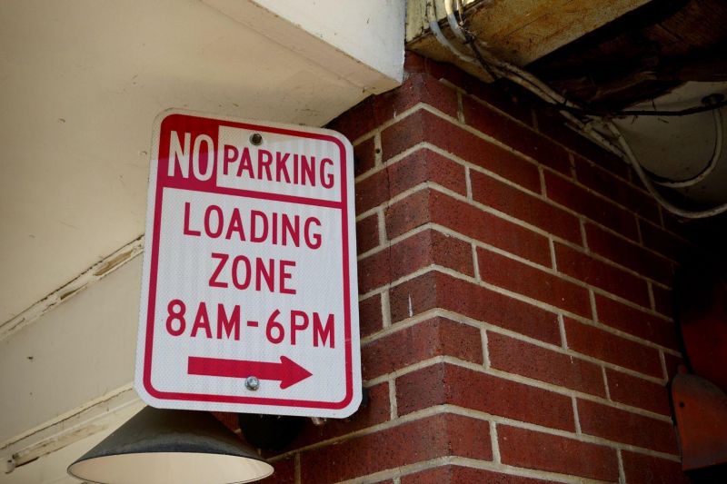 What vehicles can park in a loading zone?