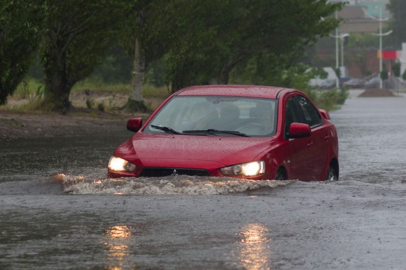 Is it illegal to drive in floodwaters or flooded roads?