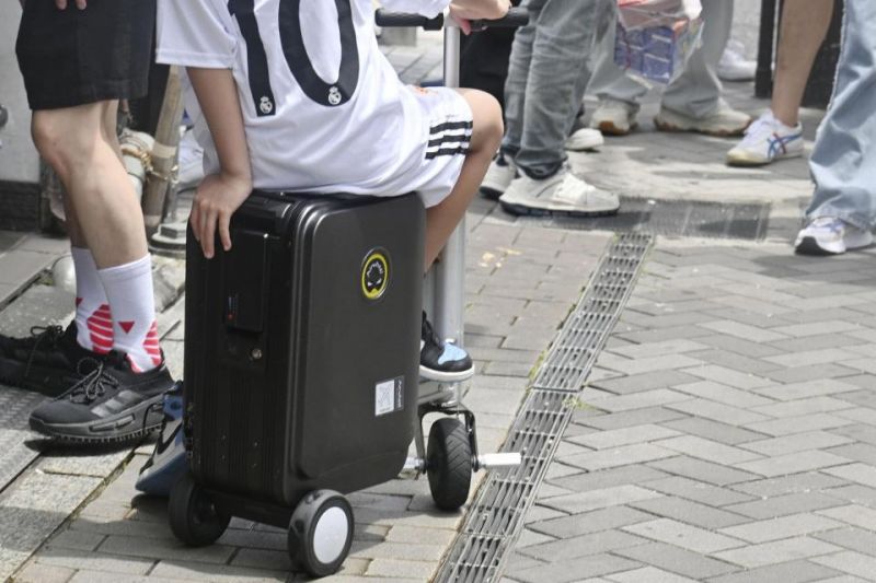 Want to ride an electric suitcase in Japan? You'll need a helmet... and a driver's licence