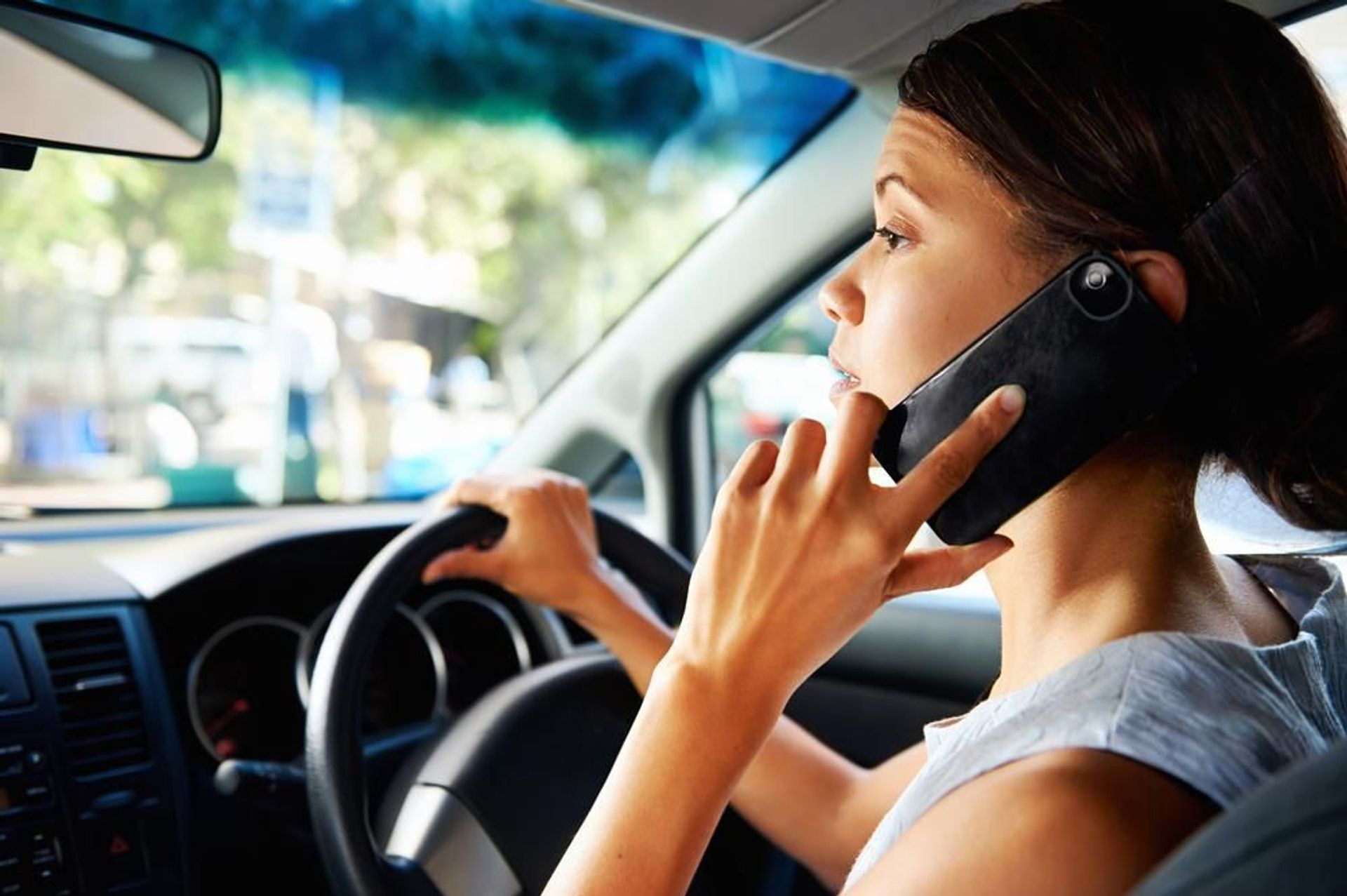 Is it illegal to use a mobile phone while driving? | CarExpert