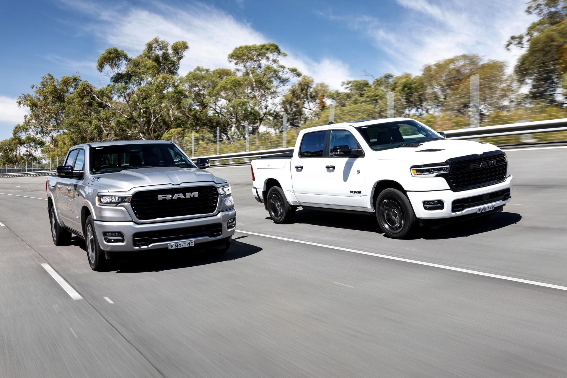 2025 Ram 1500 Limited white and Laramie Sport silver pickup trucks