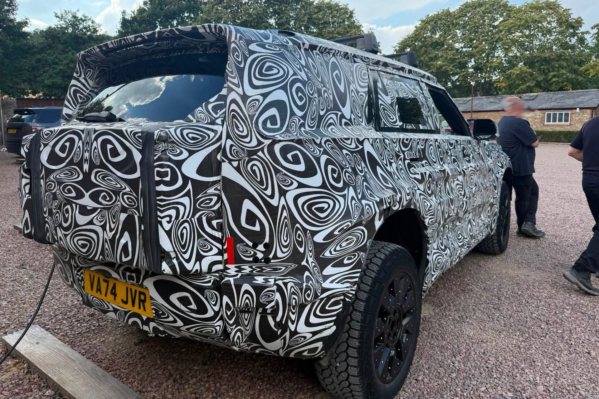 Land Rover Defender England Land Rover Defender Sport EV spied up close | CarExpert