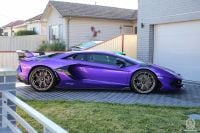 Lamborghinis, McLaren seized in NSW counterfeiting ring bust