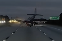 Watch the moment a plane crash-lands on a car on a busy highway