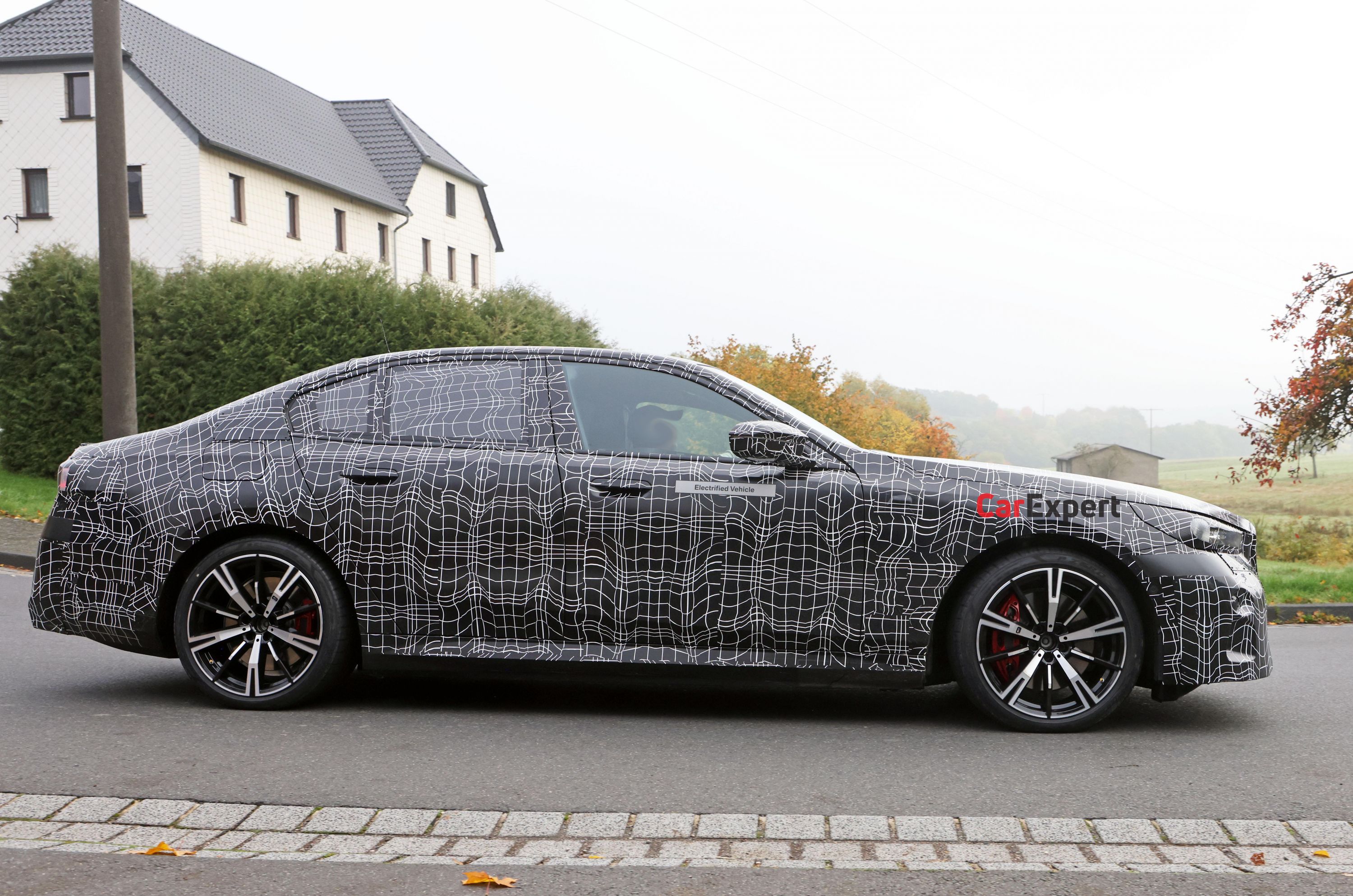 2024 BMW M5 plug-in hybrid spied looking glued to the road