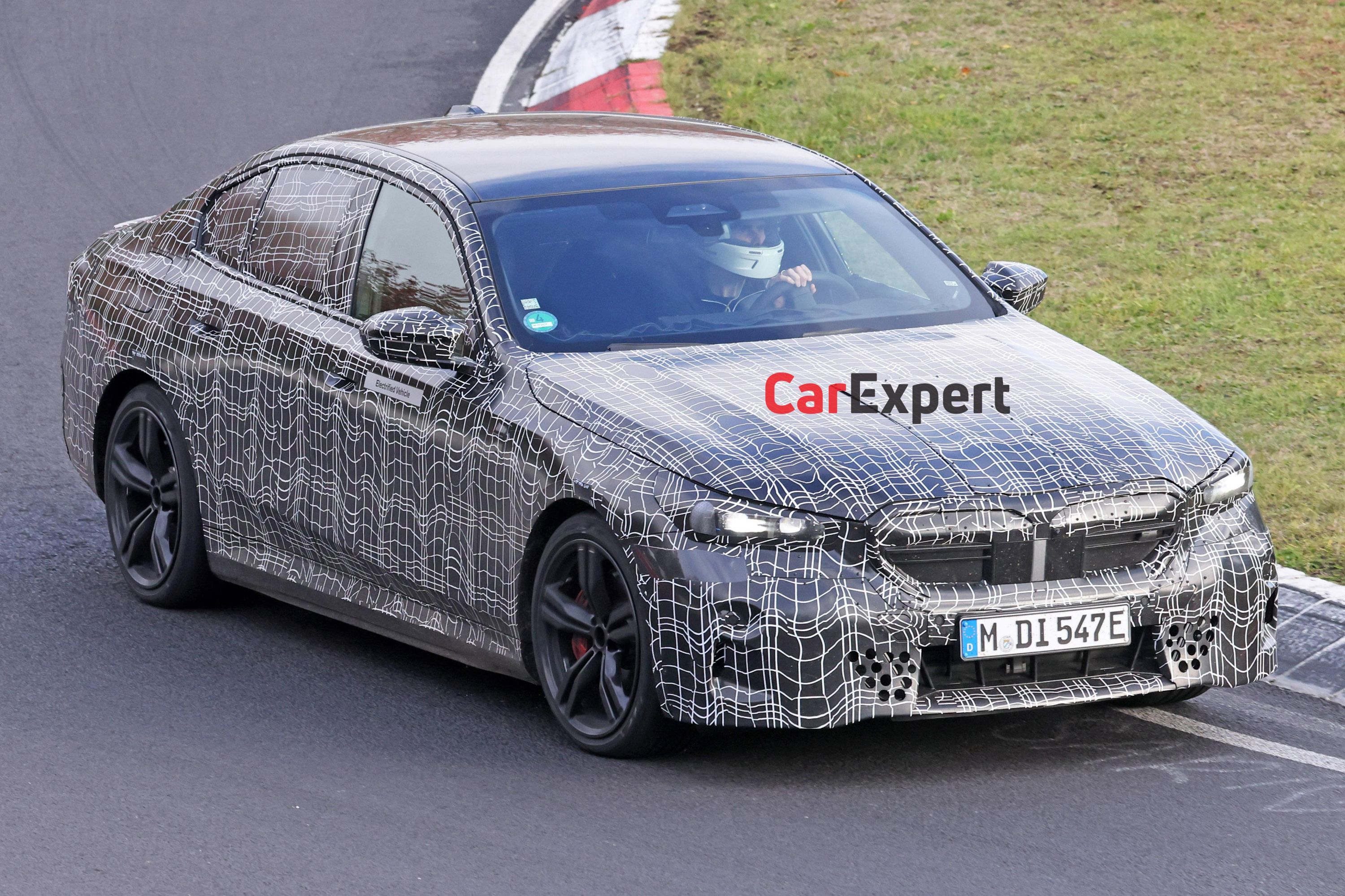 2024 BMW M5 plug-in hybrid spied looking glued to the road