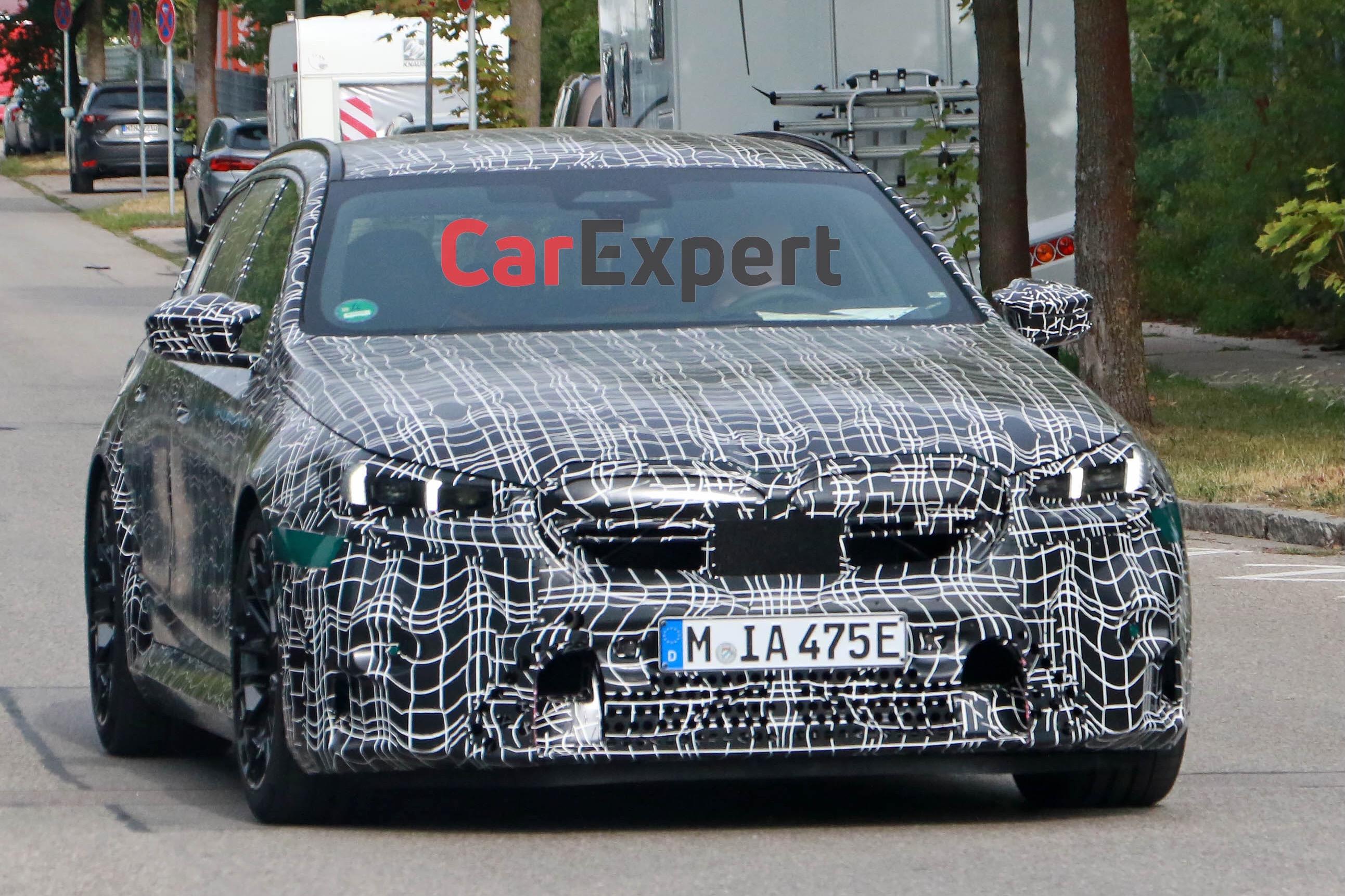 BMW’s high-performance hero wagon spied
