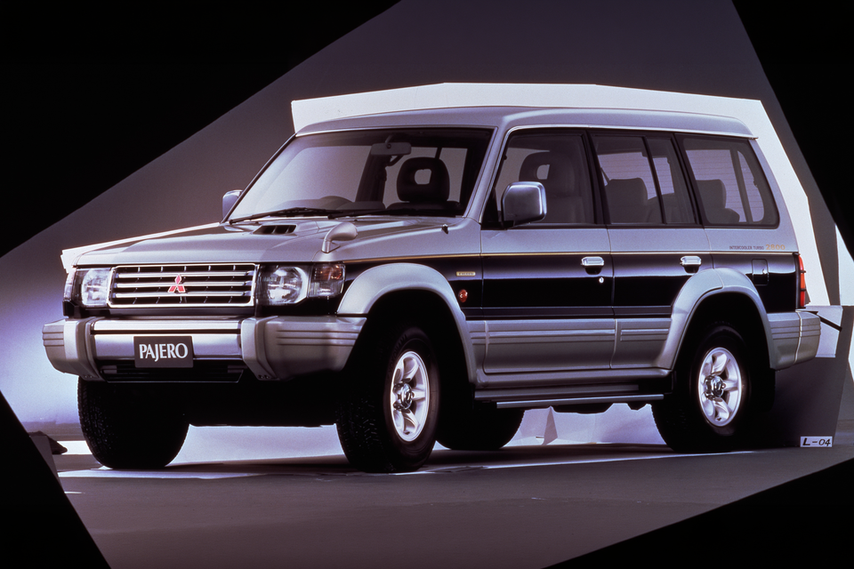 A 1994 Mitsubishi Pajero second-generation SUV shown from the front-side angle in a studio setting