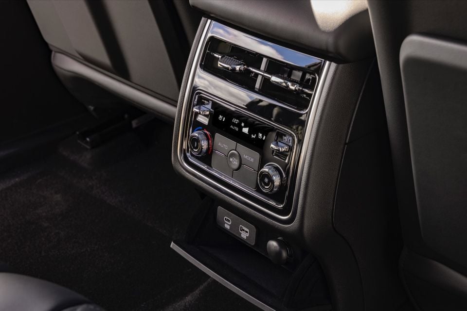 Close-up of the rear centre console in a GWM Tank 500 showing climate control dials, air vents and USB-C and USB-A charging ports