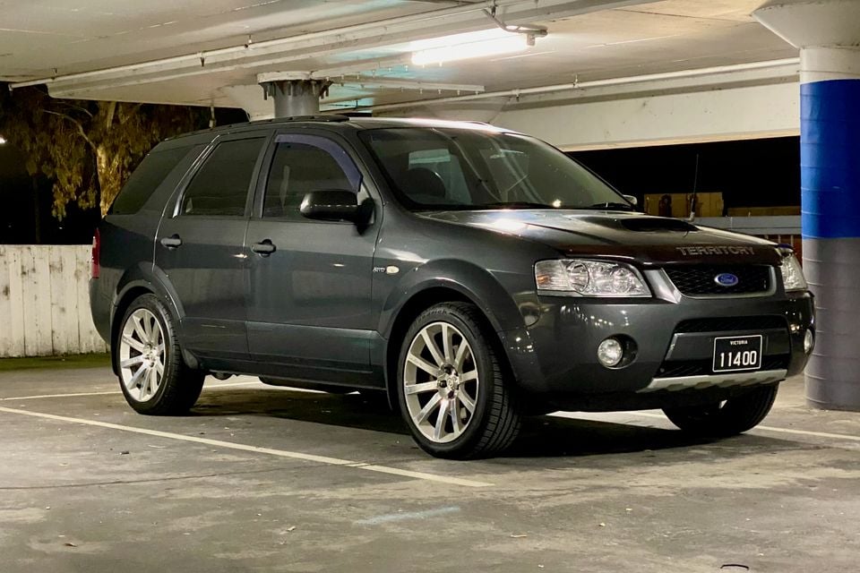 A dark grey 2006 Ford Territory Turbo SUV parked in a multi-level car park, seen from the front quarter view.