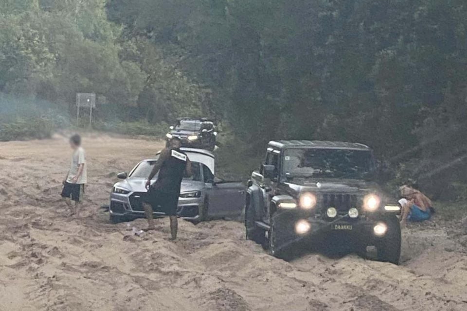 An Audi S5 bogged in the Bribie Island recreation area