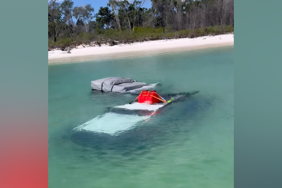 A Jeep Wrangler underwater at K’gari (Fraser Island)